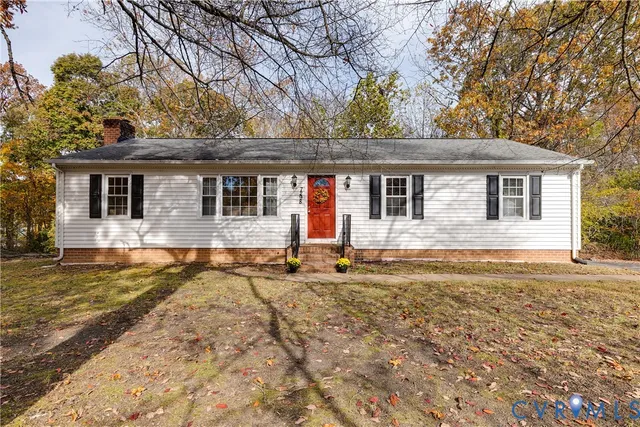 a front view of a house with outdoor seating