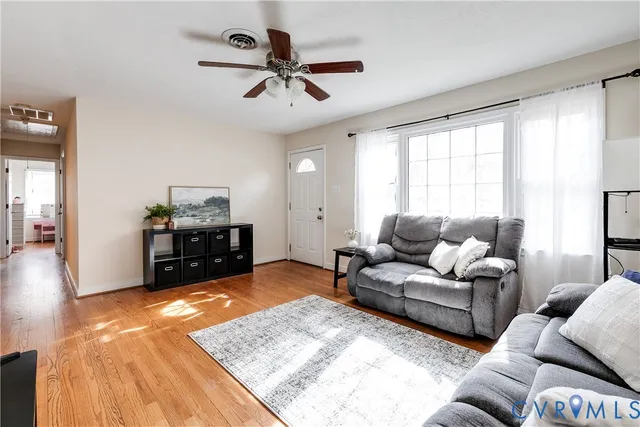 a bedroom with furniture and a wooden floor