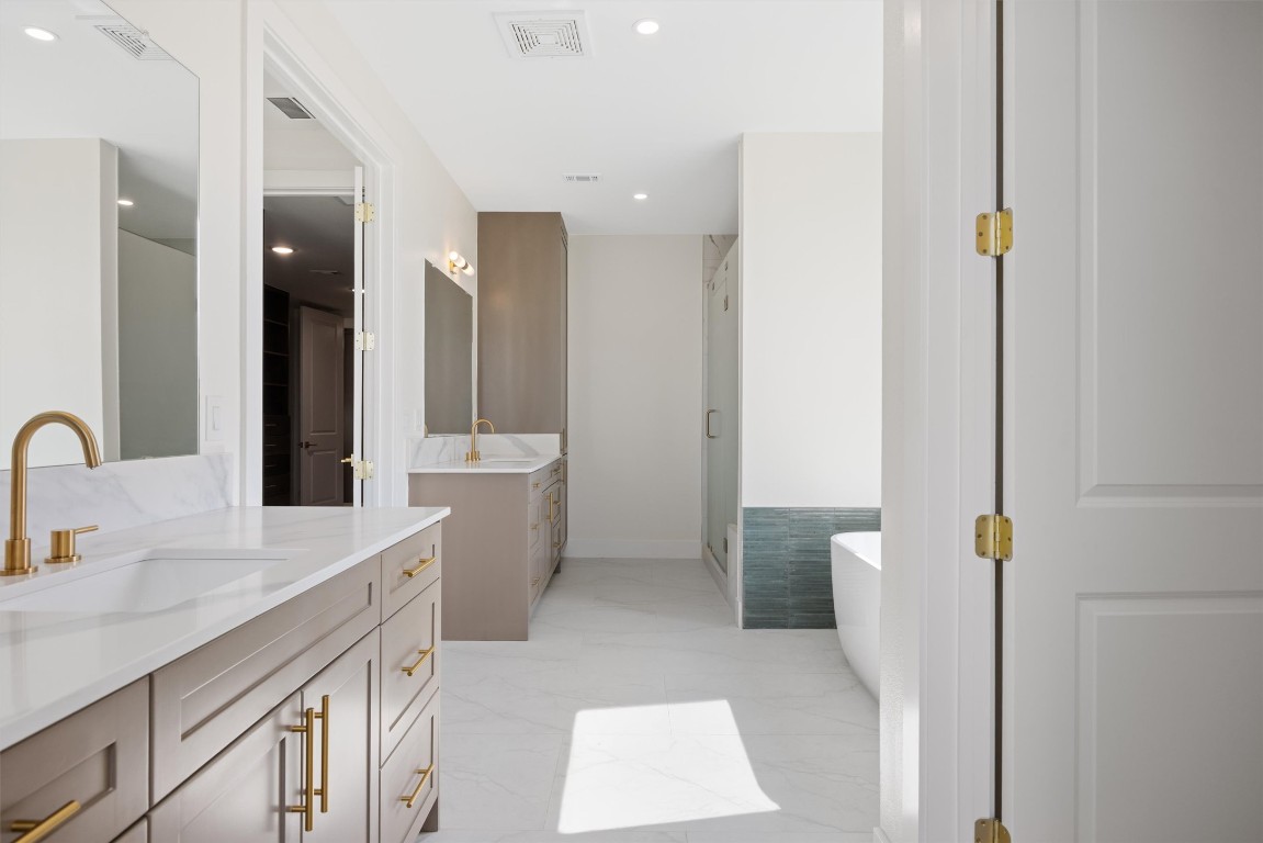 109 Fall Drive Georgetown, TX 78633 - Photo 23 of 40 a bathroom with a double vanity sink a toilet and a mirror
