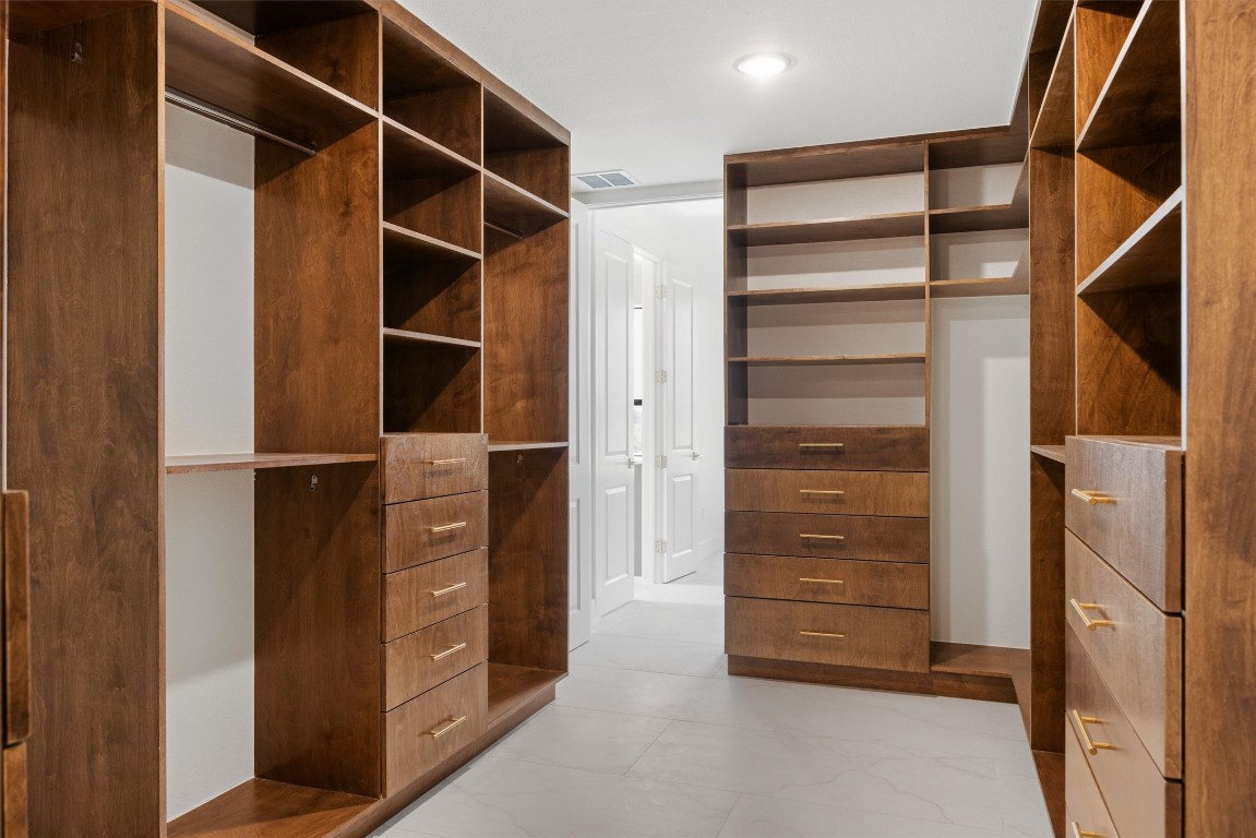 109 Fall Drive Georgetown, TX 78633 - Photo 26 of 40 a view of walk in closet with clothes