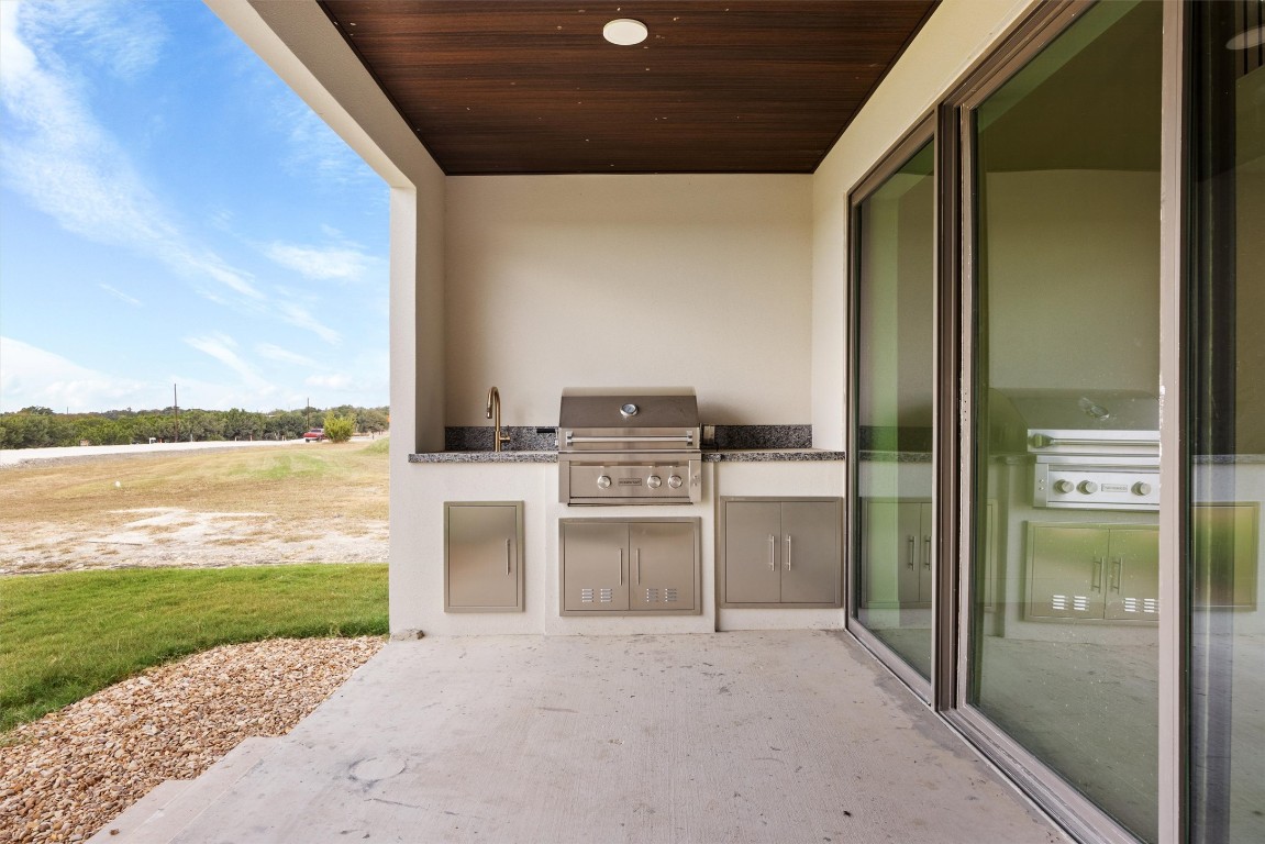 109 Fall Drive Georgetown, TX 78633 - Photo 34 of 40 a view of a kitchen with a sink and a refrigerator