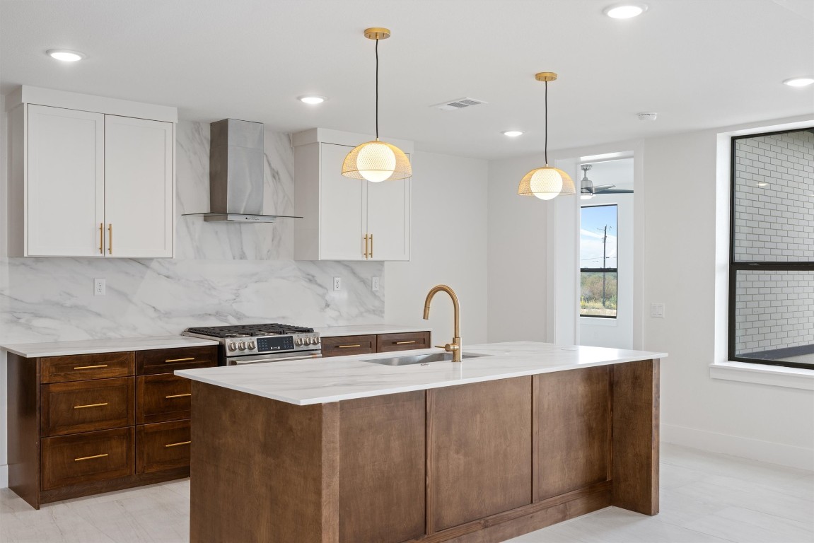 109 Fall Drive Georgetown, TX 78633 - Photo 9 of 40 a kitchen with a sink a counter space appliances and cabinets