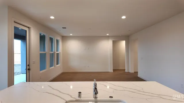 a view of a hallway with windows