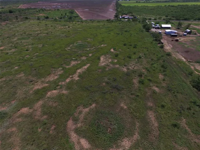 a view of a street with a yard