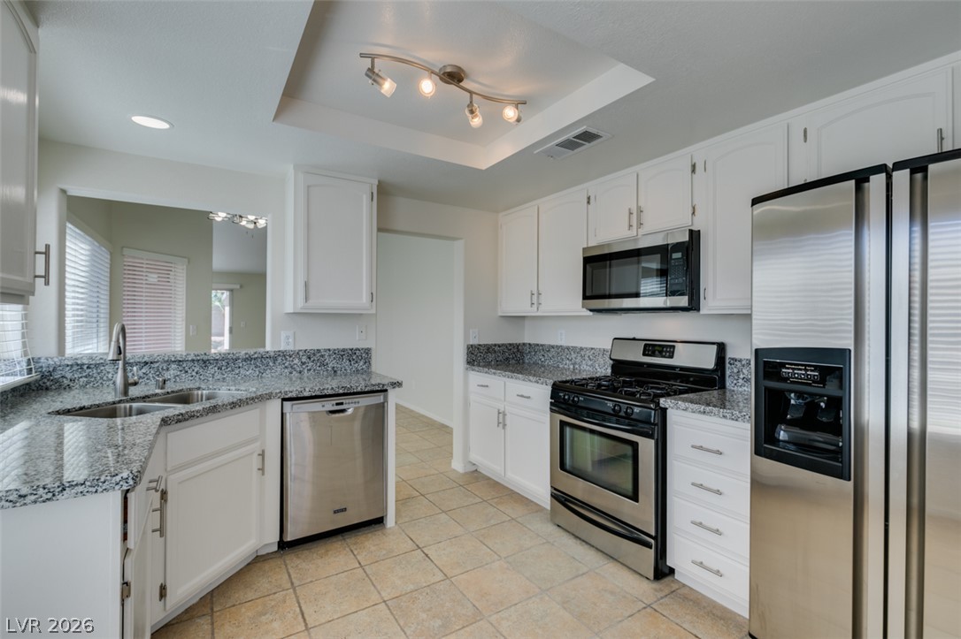 307 Cavalla Street Henderson, NV 89074 - Photo 28 of 44 Culinary delights await in this bright kitchen, complete with generous counter space and contemporary stainless steel appliances.