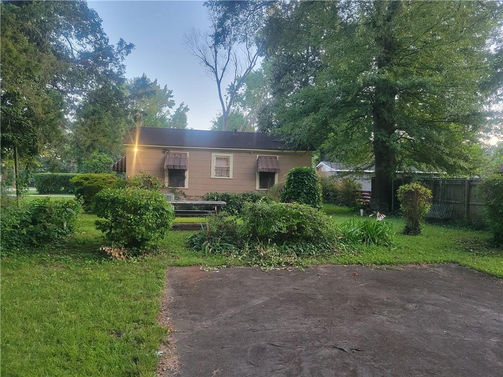 1767 Thomas Street Decatur, GA 30032 - Photo 5 of 24 a front view of a house with a yard and a tree