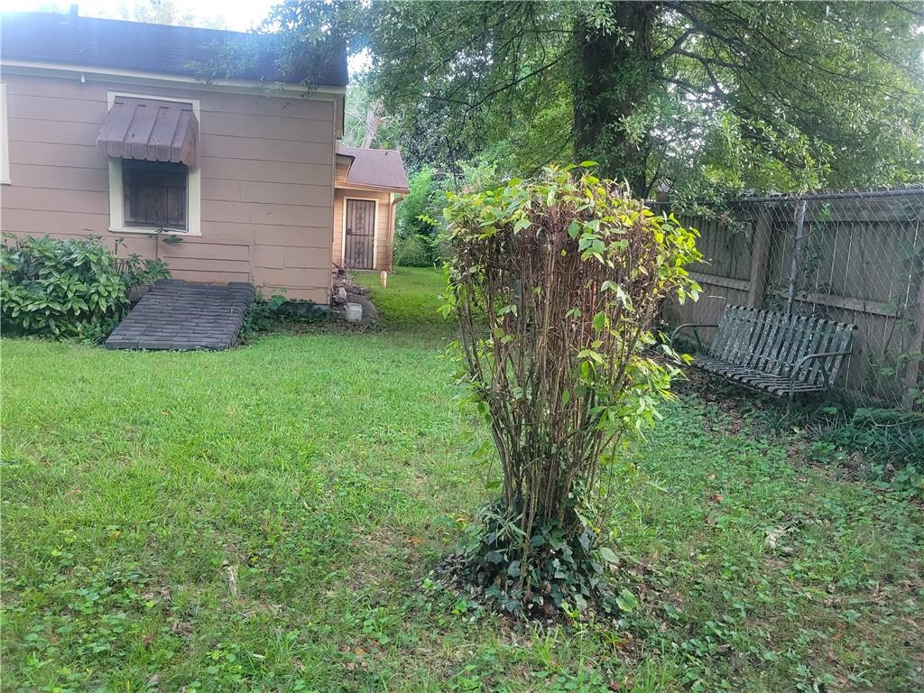 1767 Thomas Street Decatur, GA 30032 - Photo 8 of 24 a view of a house with a yard and plants