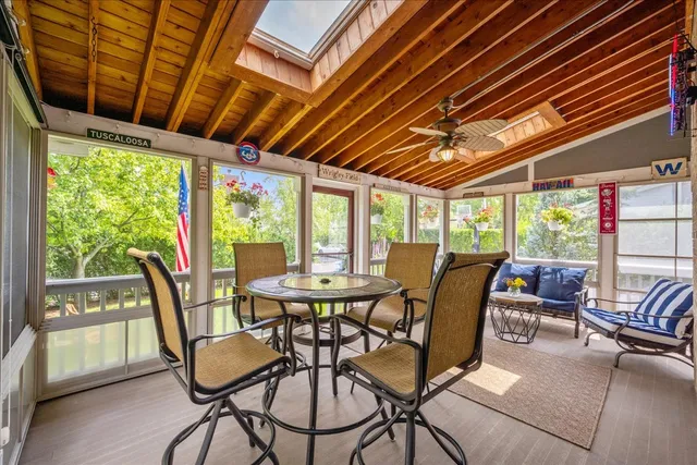 a view of a patio with table and chairs