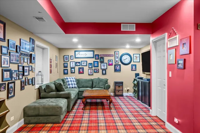 a living room with furniture and a rug