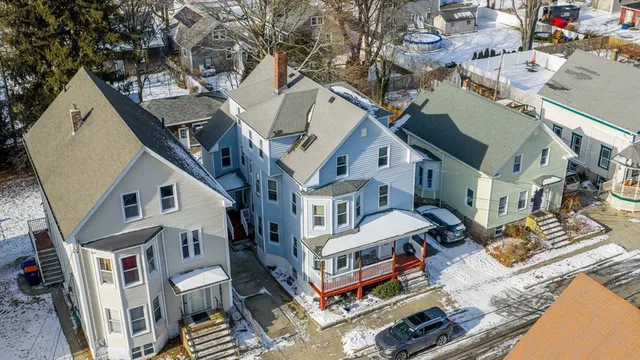 a view of a house with a yard and balcony