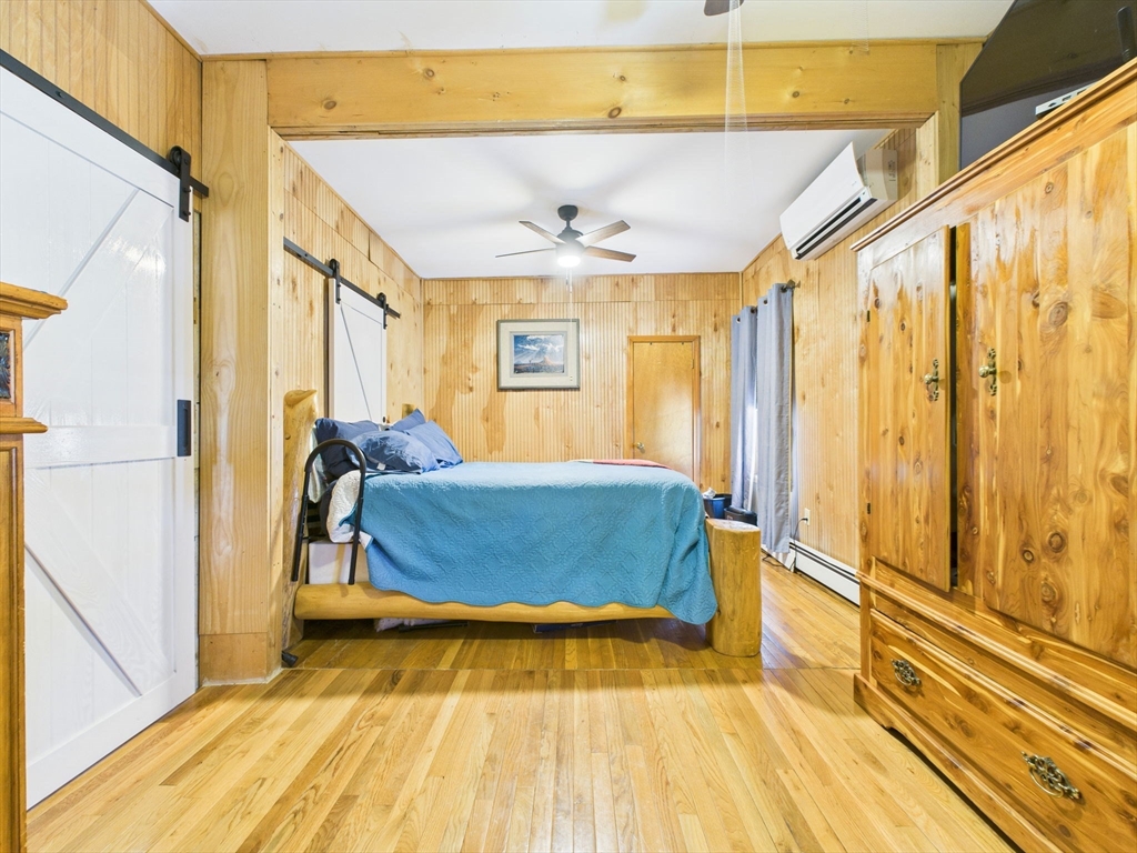 371 Reed Street New Bedford, MA 02740 - Photo 11 of 42 a bed room with a bed and windows