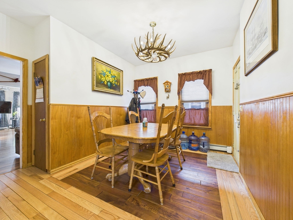 371 Reed Street New Bedford, MA 02740 - Photo 22 of 42 a view of a dining room with furniture and wooden floor
