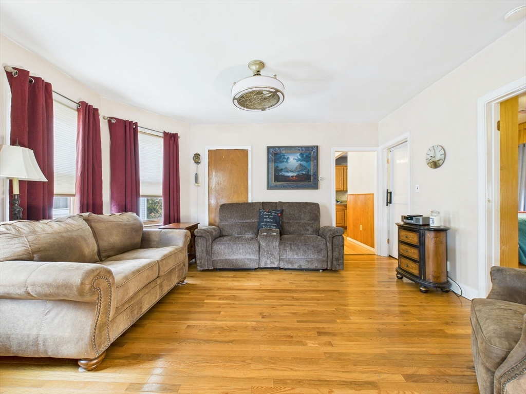 371 Reed Street New Bedford, MA 02740 - Photo 23 of 42 a living room with furniture and a large window
