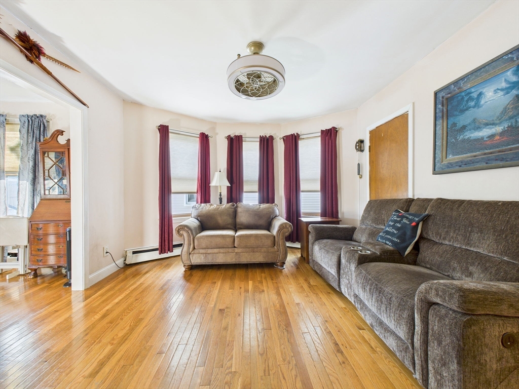 371 Reed Street New Bedford, MA 02740 - Photo 24 of 42 a living room with furniture and a wooden floor