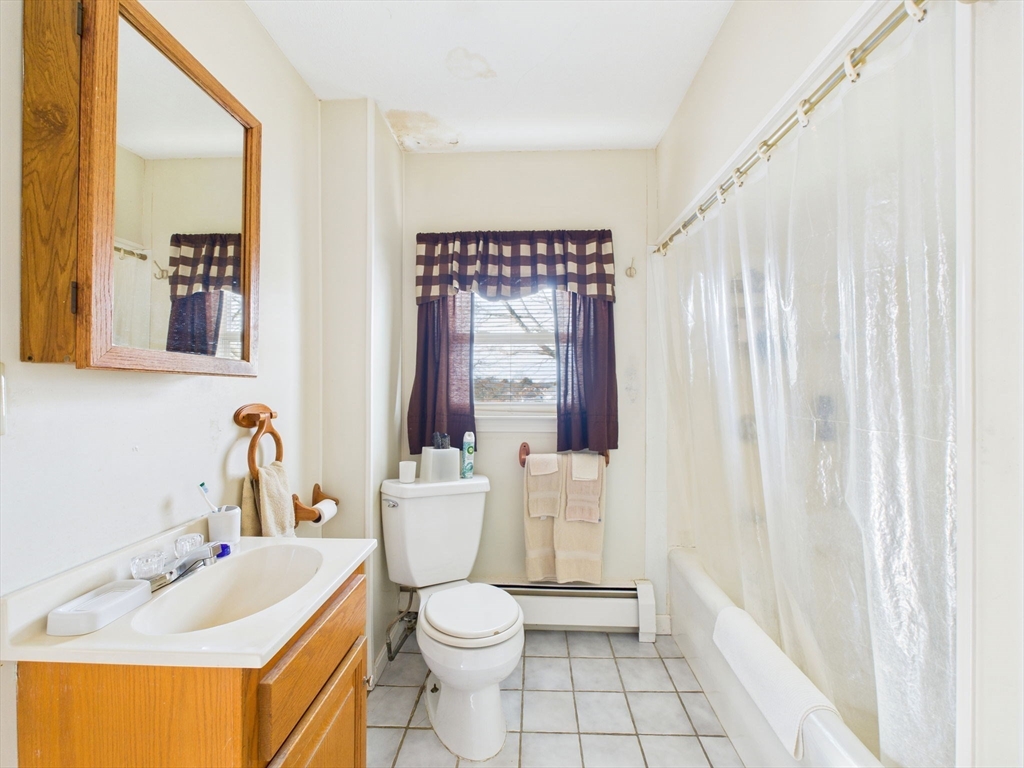 371 Reed Street New Bedford, MA 02740 - Photo 32 of 42 a bathroom with a sink toilet and shower