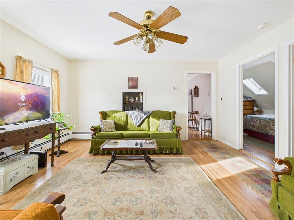 371 Reed Street New Bedford, MA 02740 - Photo 33 of 42 a living room with furniture and a flat screen tv