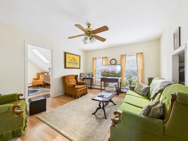 a living room with furniture and a table