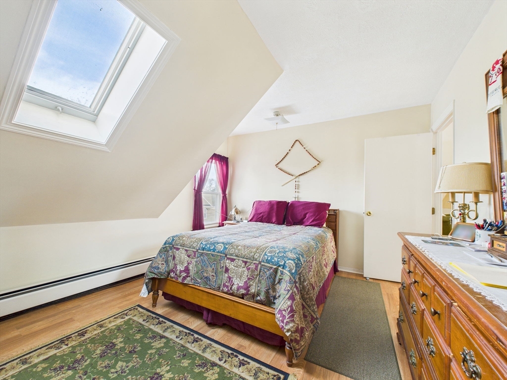 371 Reed Street New Bedford, MA 02740 - Photo 39 of 42 a bedroom with a bed and a dresser