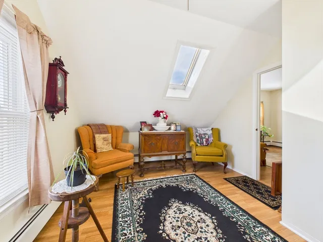 a living room with furniture and a rug