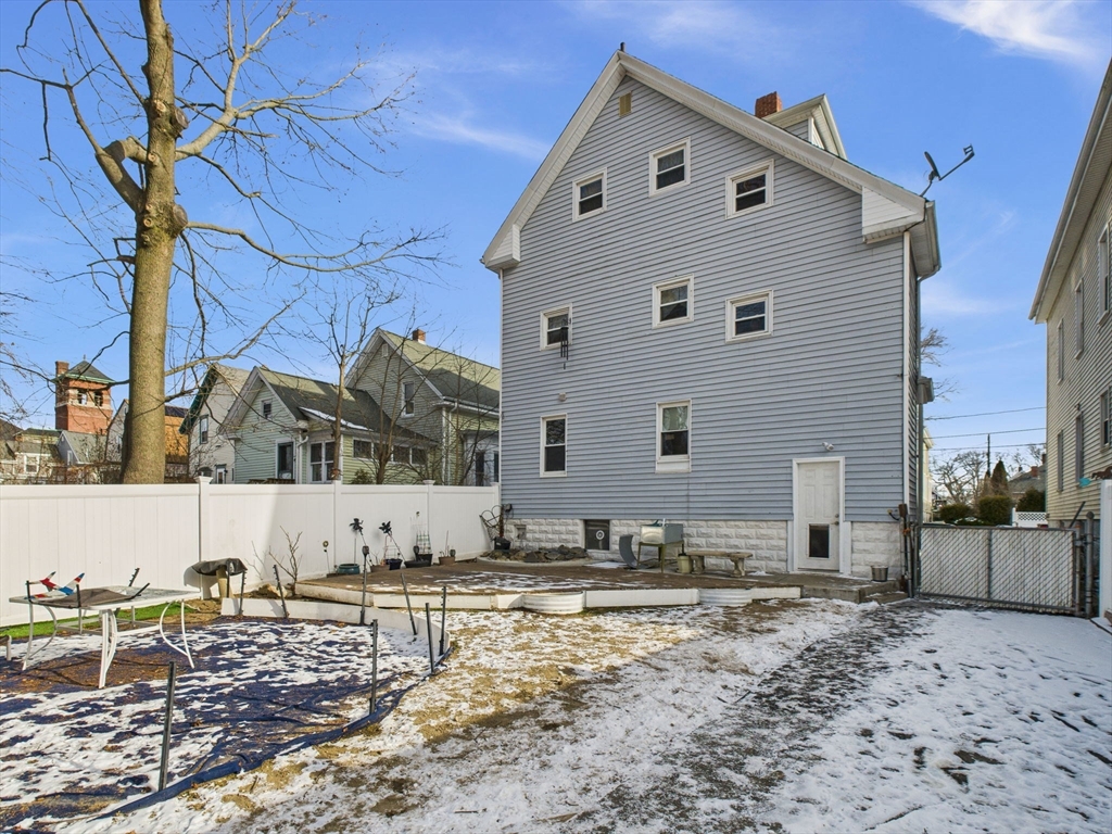 371 Reed Street New Bedford, MA 02740 - Photo 5 of 42 a view of a house with a yard