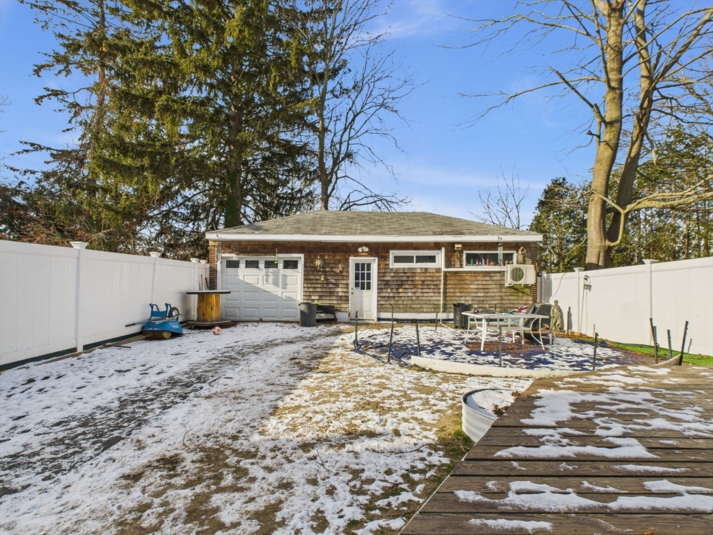 371 Reed Street New Bedford, MA 02740 - Photo 7 of 42 a front view of a house with a yard