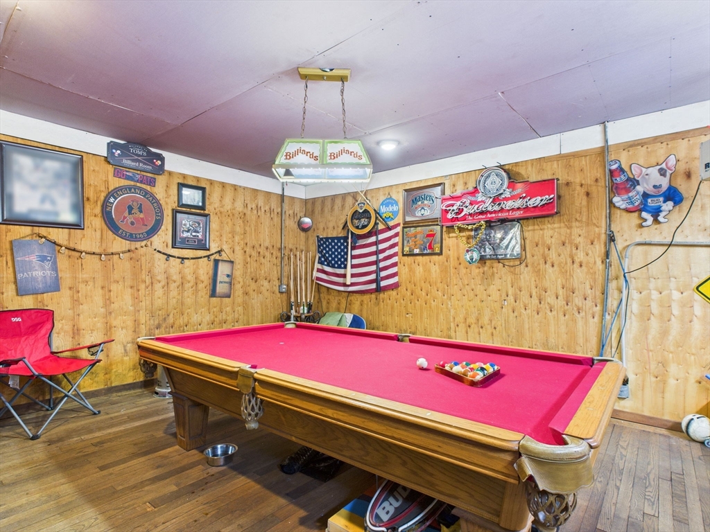 371 Reed Street New Bedford, MA 02740 - Photo 8 of 42 a room with pool table and a chandelier