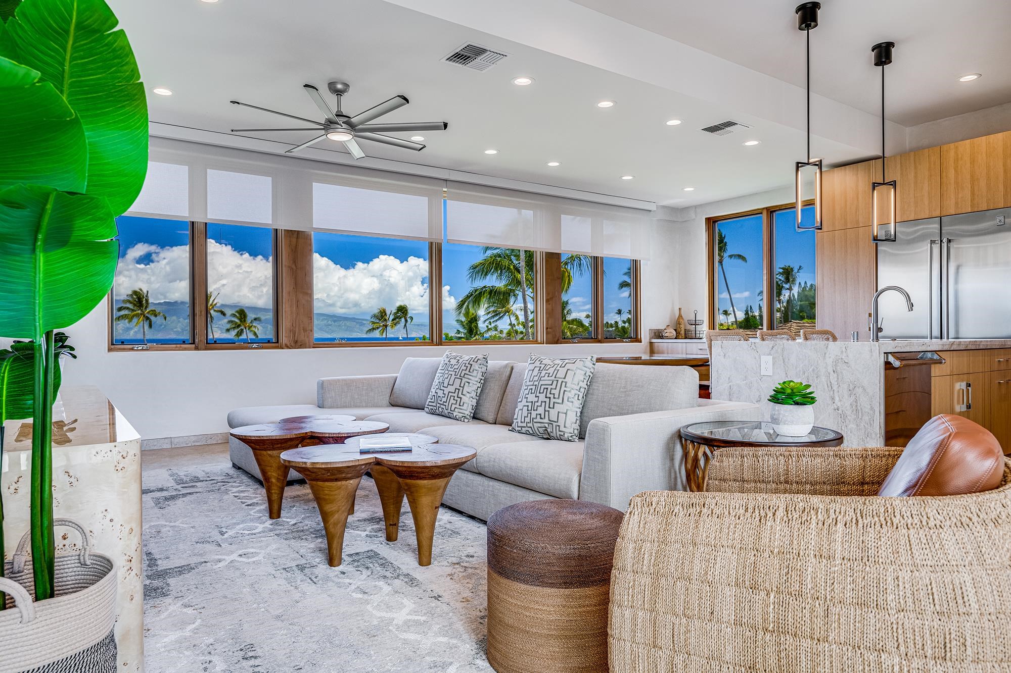 5385 Lower Honoapiilani Road Lahaina, HI 96761 - Photo 15 of 42 a living room with furniture a chandelier and a flat screen tv
