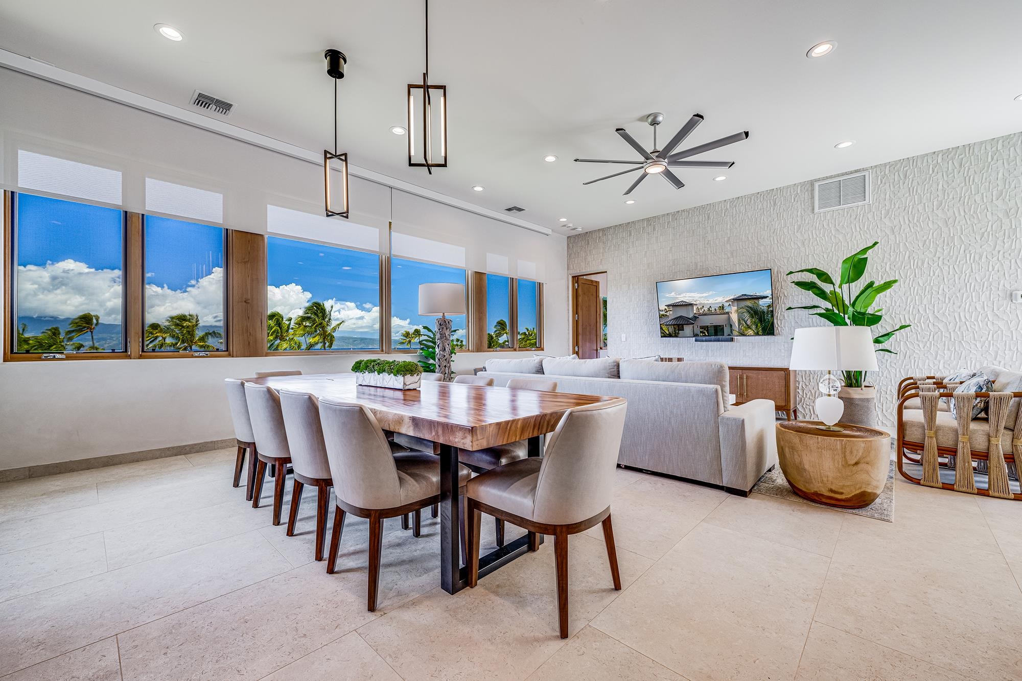 5385 Lower Honoapiilani Road Lahaina, HI 96761 - Photo 16 of 42 a dining room with furniture a window and a chandelier