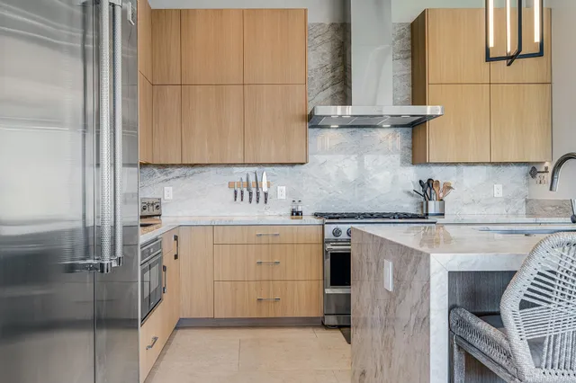 a kitchen with cabinets appliances and a sink