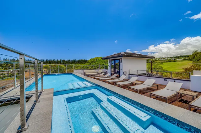 a view of a balcony with chairs
