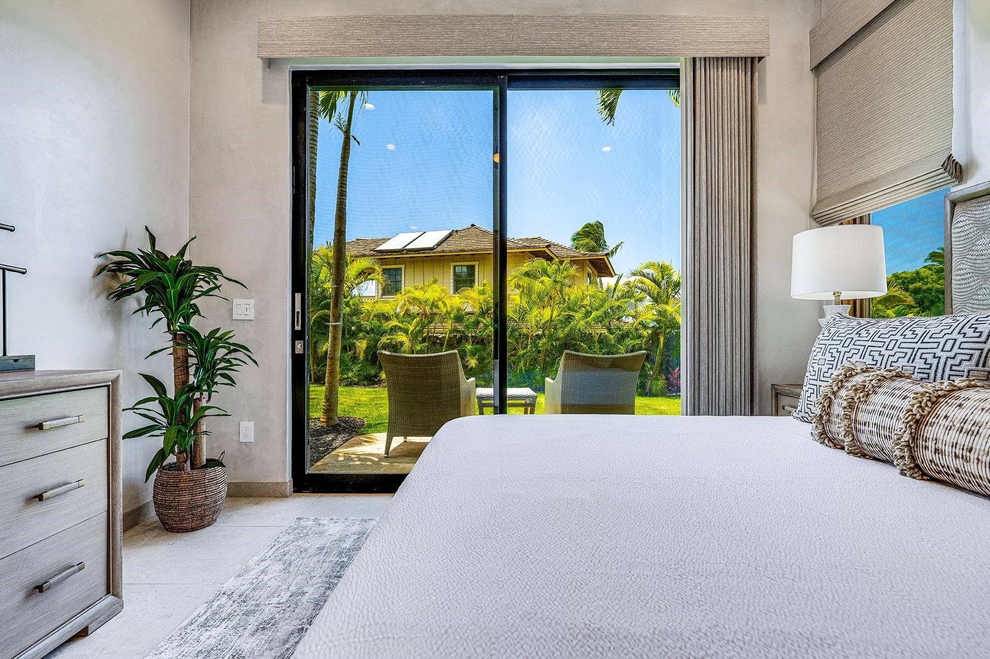 5385 Lower Honoapiilani Road Lahaina, HI 96761 - Photo 22 of 42 a bed sitting in a bedroom next to a window