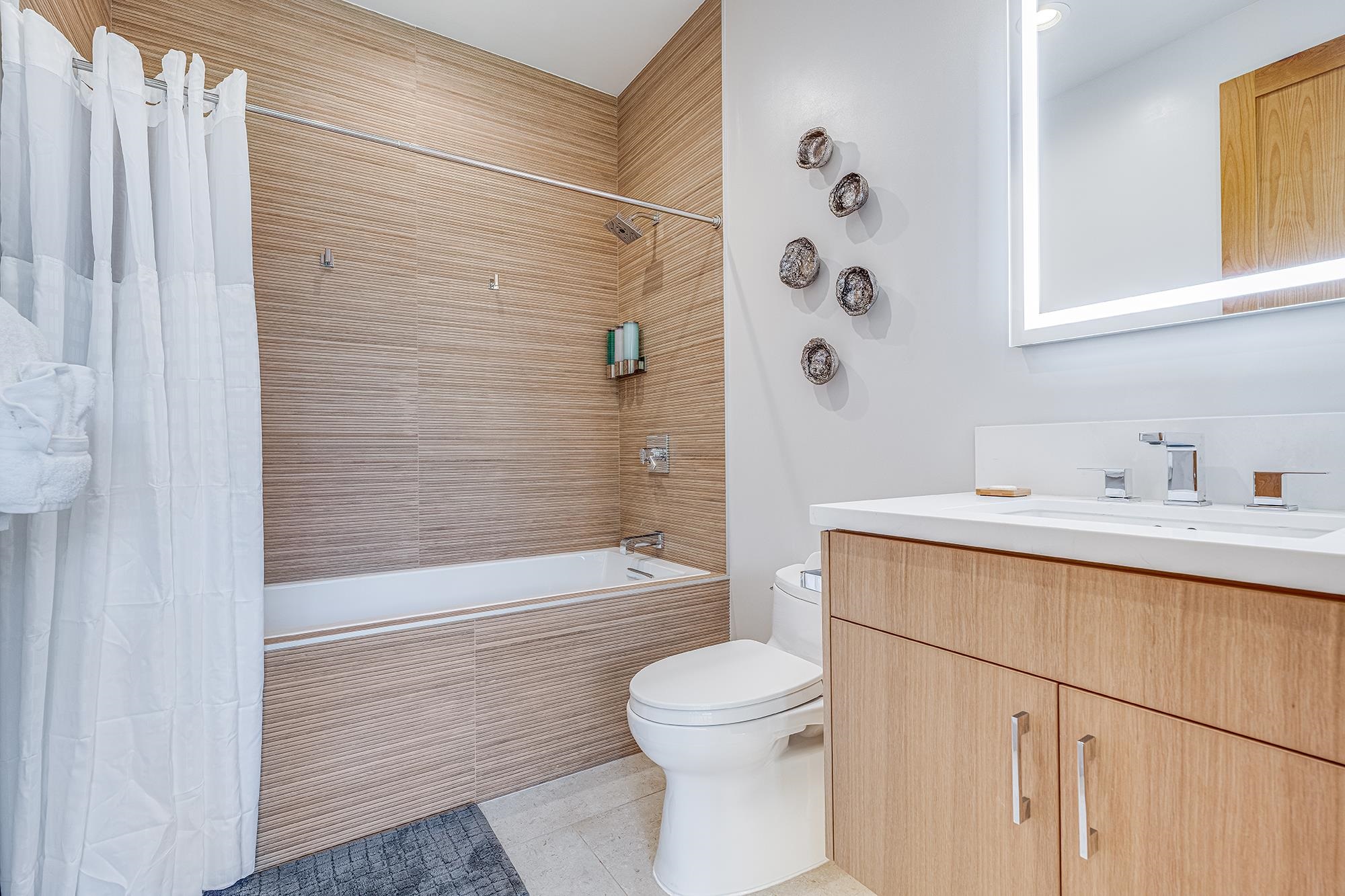5385 Lower Honoapiilani Road Lahaina, HI 96761 - Photo 26 of 42 a bathroom with a sink a toilet and shower