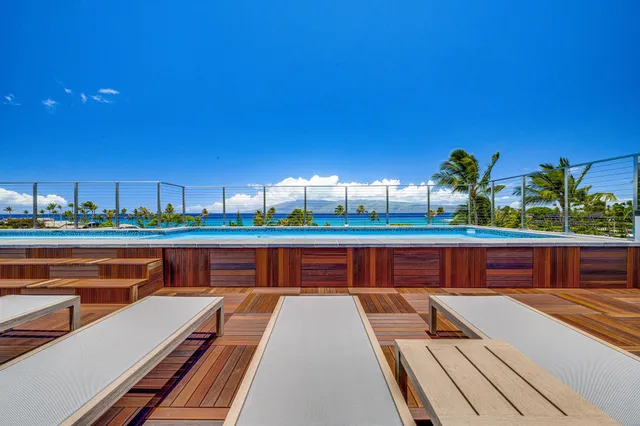a view of swimming pool with outdoor seating and city view