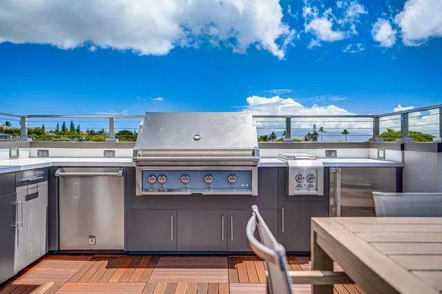 a kitchen with a stove and a refrigerator