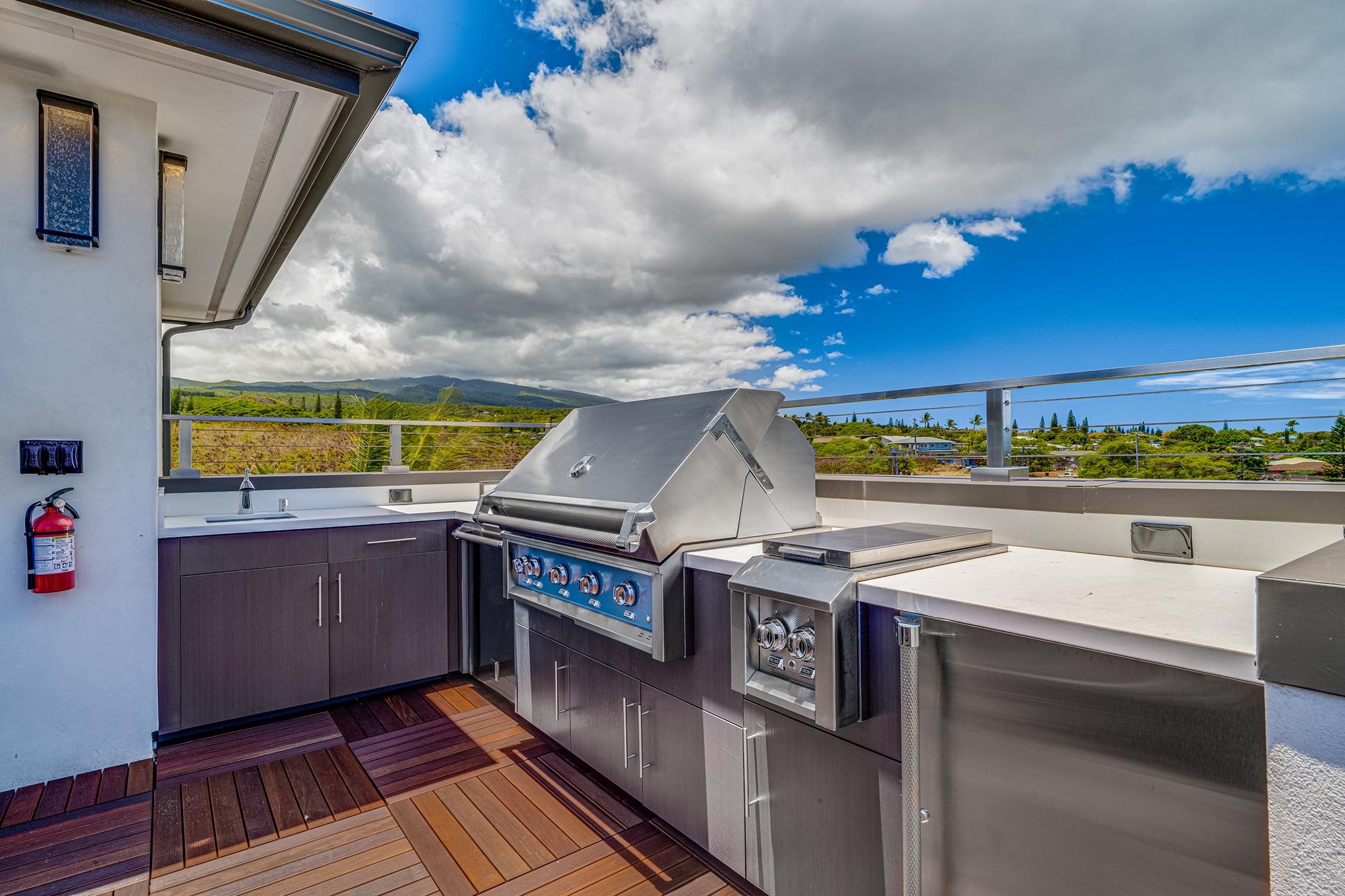5385 Lower Honoapiilani Road Lahaina, HI 96761 - Photo 38 of 42 a terrace with outdoor seating and stove