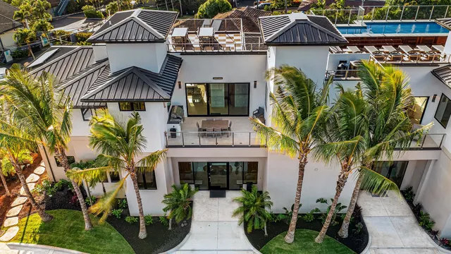 a front view of house with yard and outdoor seating