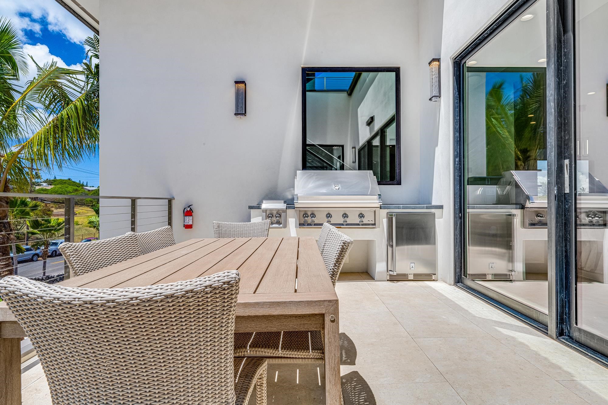 5385 Lower Honoapiilani Road Lahaina, HI 96761 - Photo 5 of 42 a bed room with a bed and a fireplace