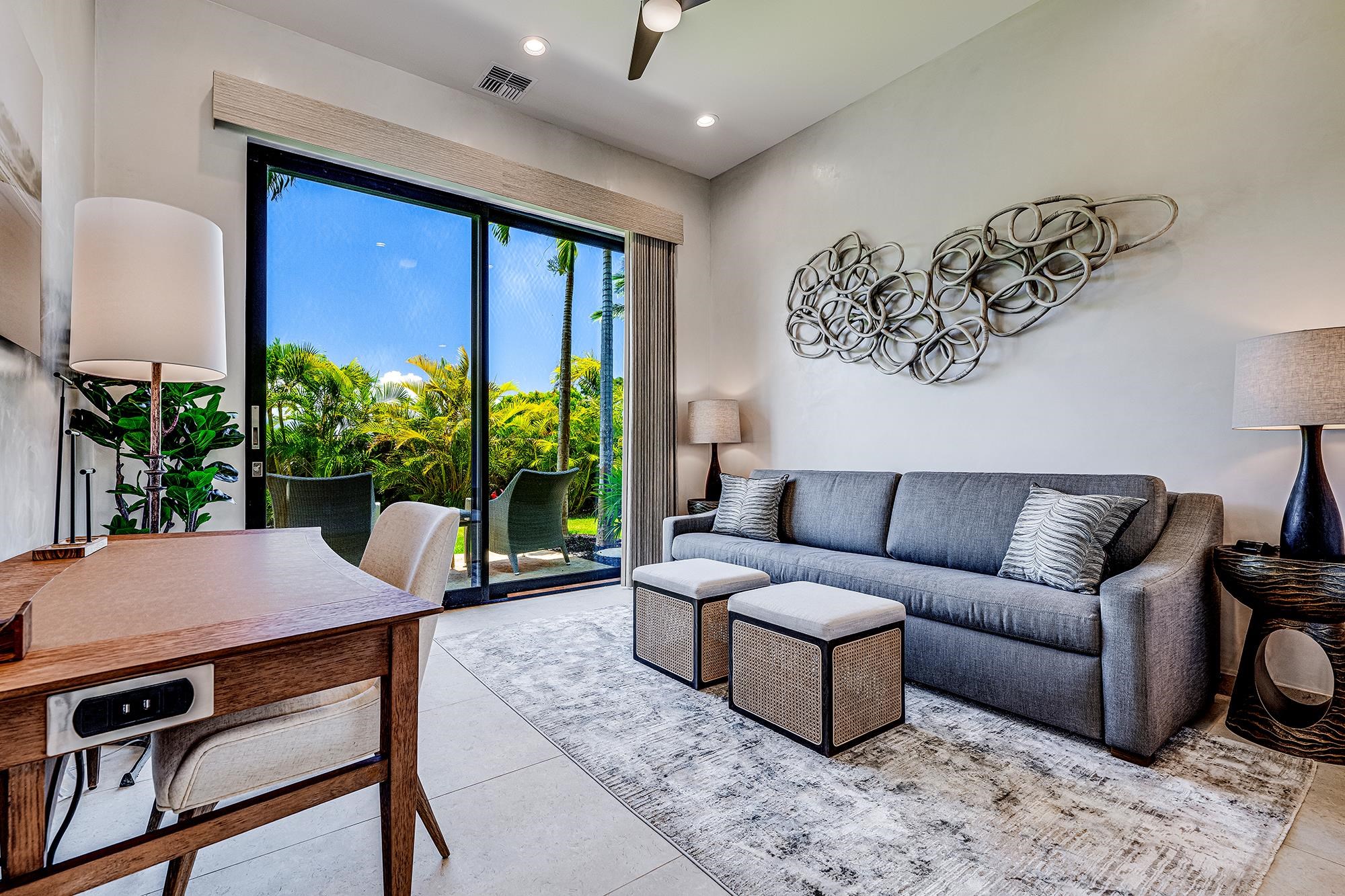 5385 Lower Honoapiilani Road Lahaina, HI 96761 - Photo 6 of 42 a living room with furniture and a large window