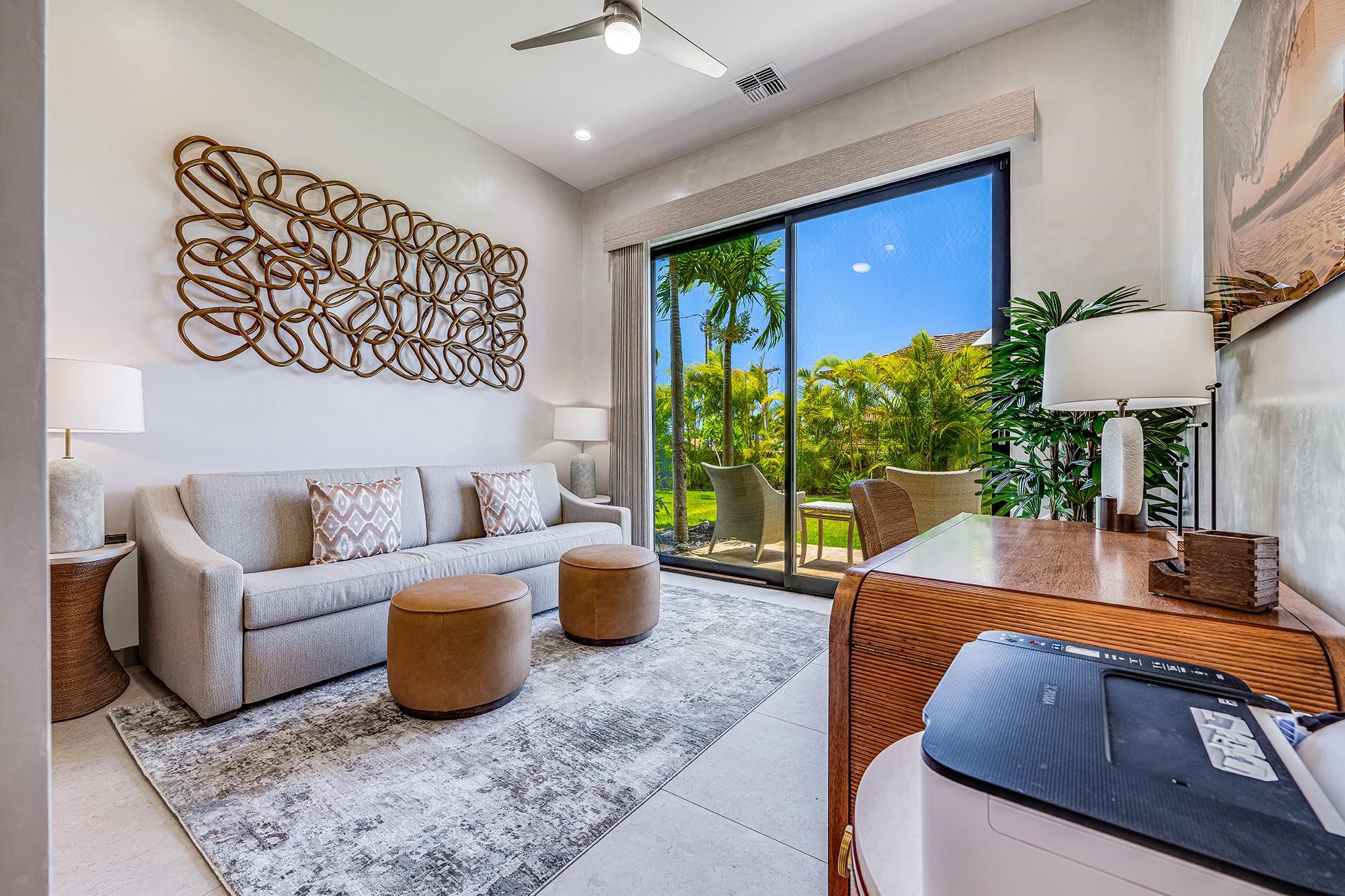 5385 Lower Honoapiilani Road Lahaina, HI 96761 - Photo 7 of 42 a living room with furniture and a large window