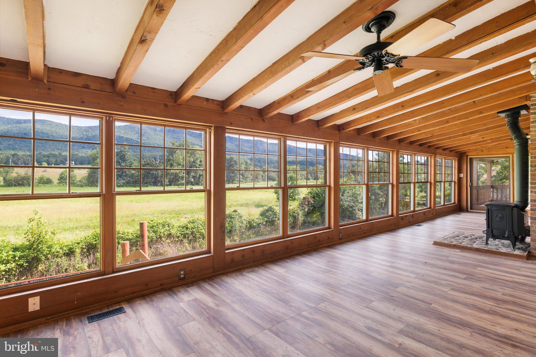 134 Spring Mountain Way Fort Valley, VA 22652 - Photo 28 of 69 Back porch with wondows for year round comfort.
