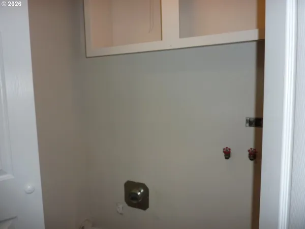 a kitchen with sink cabinets and stove top oven