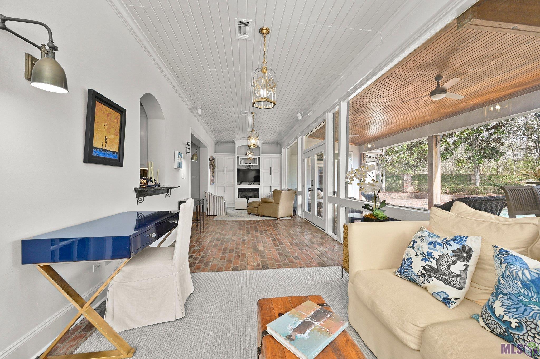 2125 Rue Bienvenue Baton Rouge, LA 70809 - Photo 10 of 37 Sunroom off the kitchen overlooking the pool