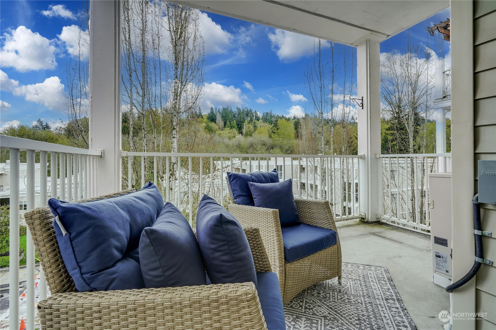 17426 Bothell Way Northeast, Unit A305 Bothell, WA 98011 - Photo 30 of 38 a living room with furniture and a floor to ceiling window