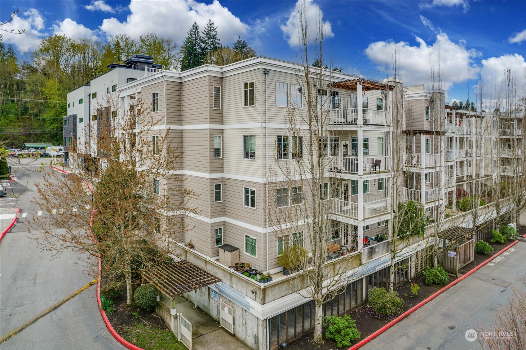 17426 Bothell Way Northeast, Unit A305 Bothell, WA 98011 - Photo 34 of 38 a large building with a lot of windows