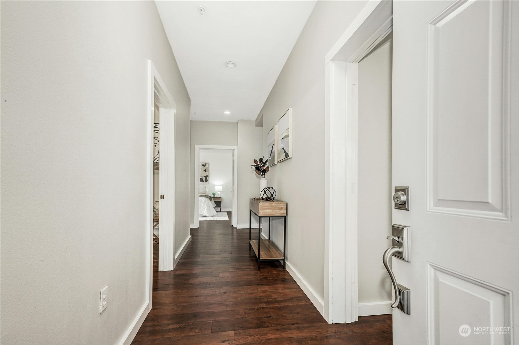 17426 Bothell Way Northeast, Unit A305 Bothell, WA 98011 - Photo 5 of 38 a view of a hallway with wooden floor and staircase
