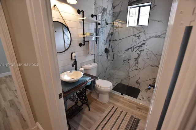 a view of livingroom with furniture and a fireplace