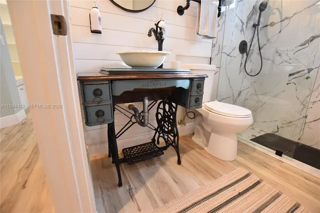a living room with furniture and a ceiling fan