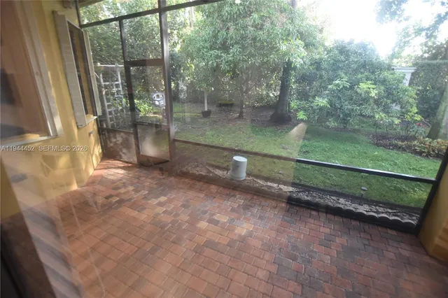 a view of a swimming pool with a patio