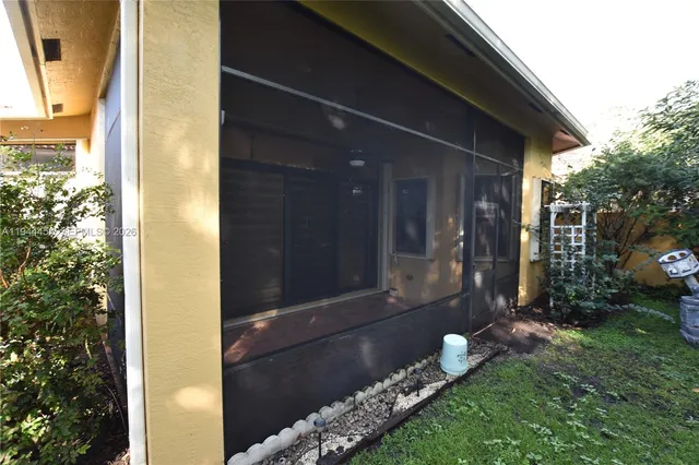 a living room with furniture a rug and a chandelier