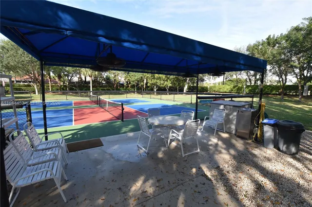 a living room with lots of white furniture